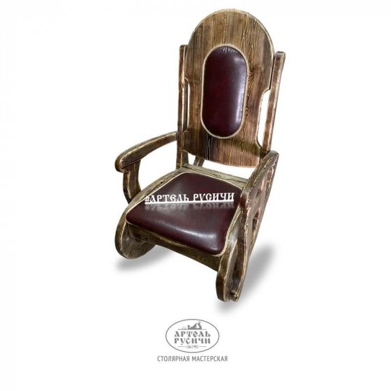 Кресло-качалка из массива дерева с мягкой обивкой 